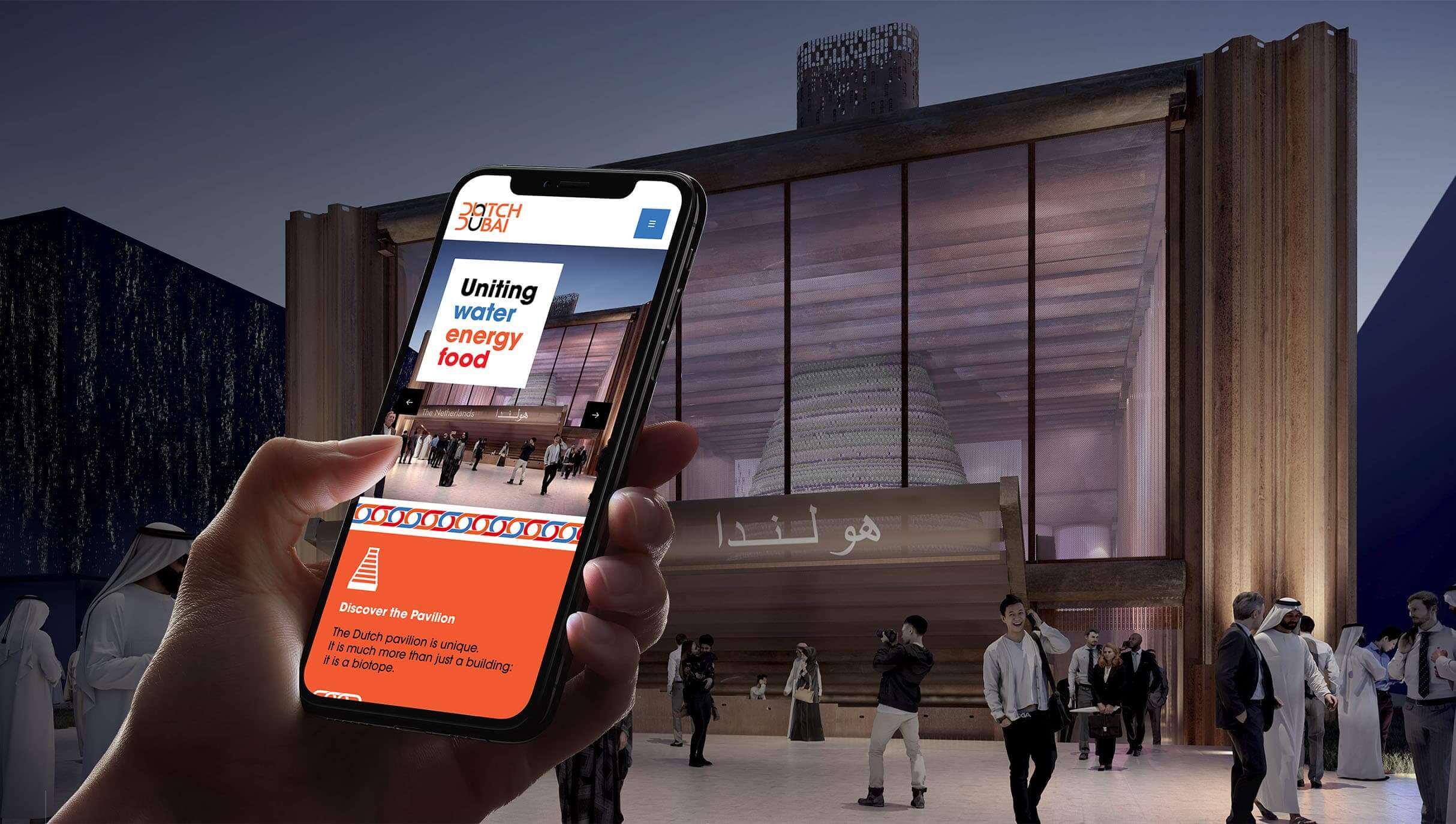 Person looking at Dutch Dubai websites on their mobile in front of pavilion